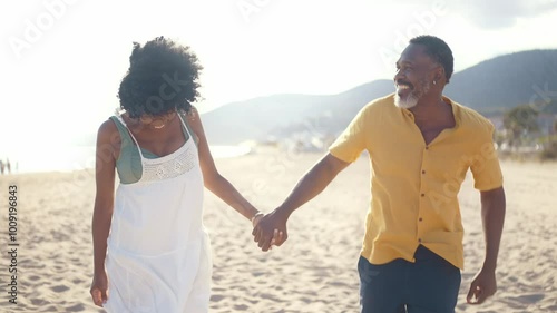 Cinematic video of an happy latin senior couple spending time at the beach. Concept  about seniority and lifestyle