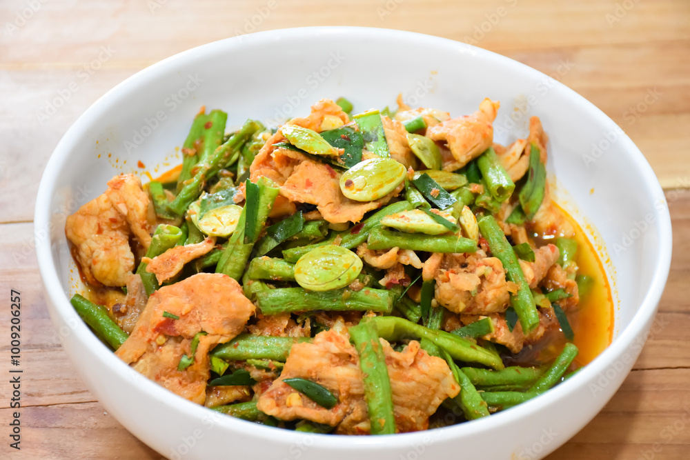 Thai food: Stir-fried pork with curry paste and green beans, very spicy. Thai food: Stir-fried pork with curry paste and green beans, very spicy.