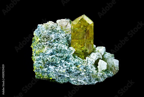 Epidote crystals with prehnite inclusions, displaying vibrant green mineral formations. photo