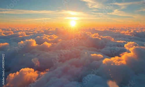 Sunrise above clouds with soft glowing light
