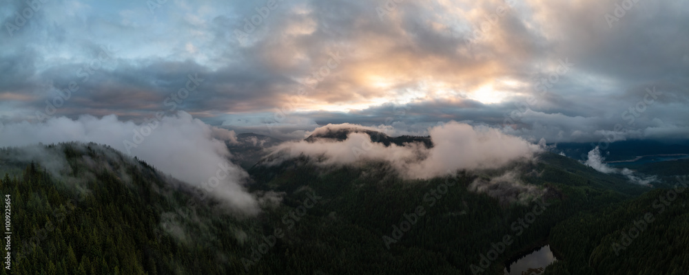 Obraz premium Breathtaking Aerial View of Stave Lake in Mission, BC, Canada at Sunset with Towering Forests and Misty Mountains