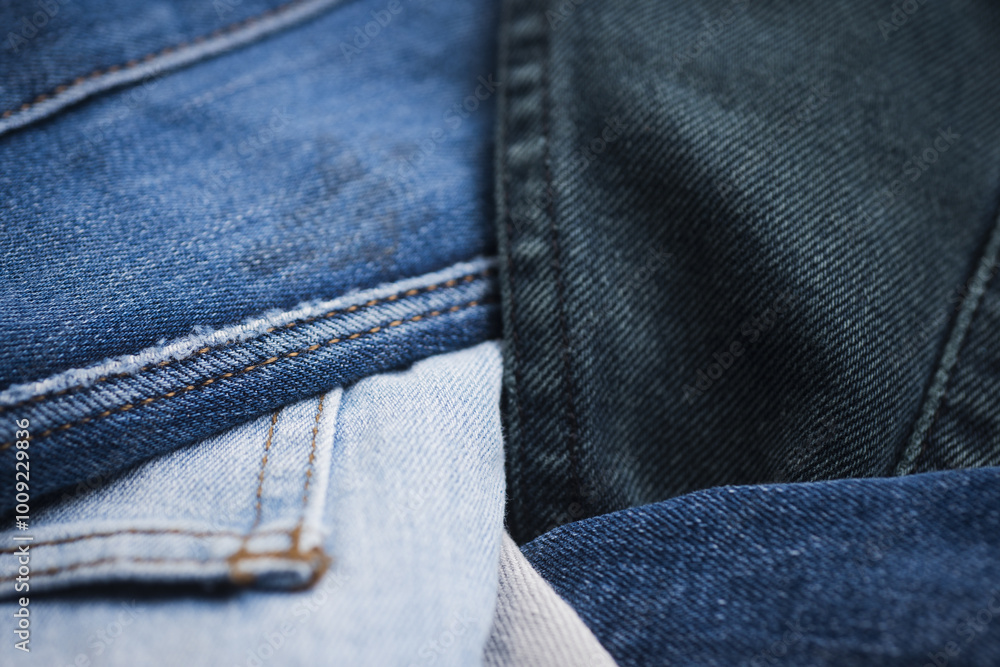 Naklejka premium Texture background of jeans. Denim jeans fashion background. Canvas denim texture. Denim jeans texture. Denim fabric textured background.