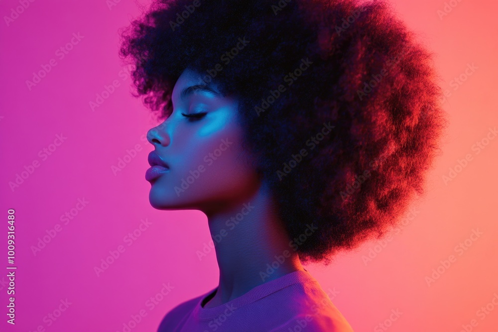 African American woman with afro hair style posing against a bright pink background, suitable for cultural or beauty related uses African American woman with afro hair style posing against a bright pink background, suitable for cultural or beauty related uses
