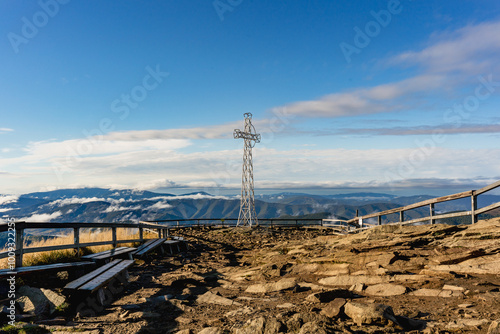 Fototapeta Naklejka Na Ścianę i Meble -  Tarnica Peak in Bieszczady on a Crisp Autumn Morning with Cross and Clear Blue Sky
