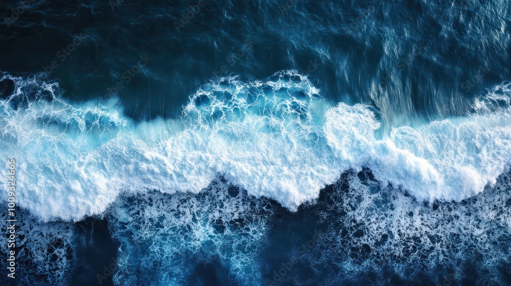 Obraz premium An impressive aerial photo showing ocean waves crashing in deep waters ideal for backgrounds A drone s bird s eye perspective captures the dynamic seascape in this captivating copy space image
