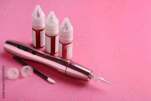 Permanent makeup equipment kit on pink background. Space for text