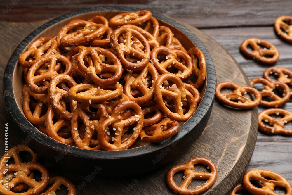 Tasty pretzel crackers on wooden table, closeup Tasty pretzel crackers on wooden table, closeup