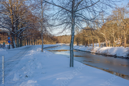Canvas Print View over the canal Djurgårdskanalen, snowy walk way and ice floats a sunny wint
