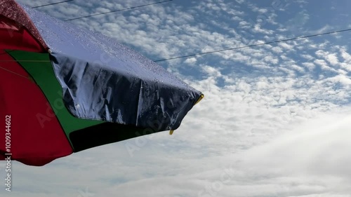 Closeup of an opened colorful umbrella