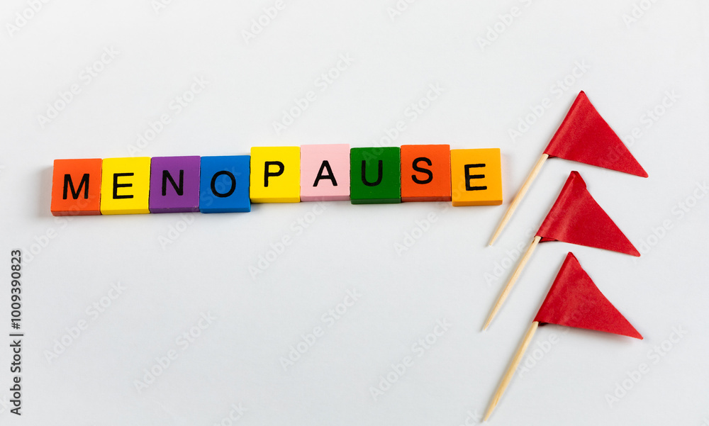 Obraz premium Menopause text in letter blocks with flags