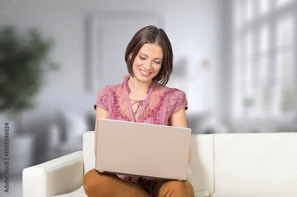 Smiling young woman use digital laptop at home. Smiling young woman use digital laptop at home.
