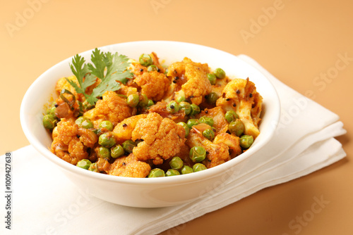 Aloo gobi is a simple vegetarian dish made with potatoes, cauliflower, spices and herbs