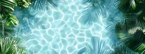 Light blue water background with palm leaves and ripples, swimming pool water, light aquamarine, tropical beach