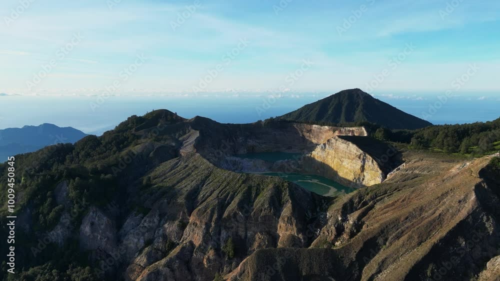 Aerial view of volcano Kelimutu with tricolored lakes in Flores Aerial view of volcano Kelimutu with tricolored lakes in Flores