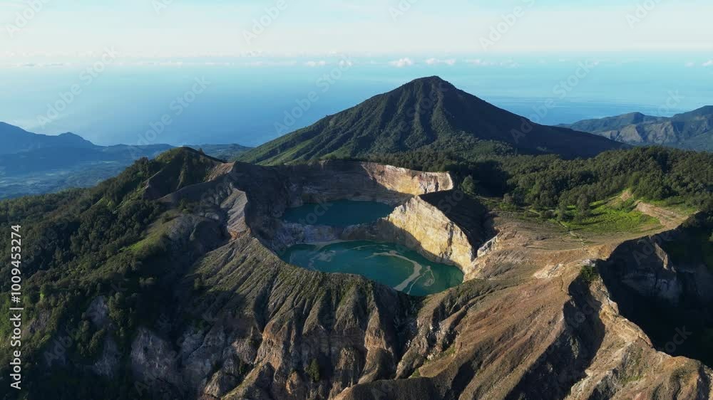 Aerial view of volcano Kelimutu with tricolored lakes in Flores Aerial view of volcano Kelimutu with tricolored lakes in Flores