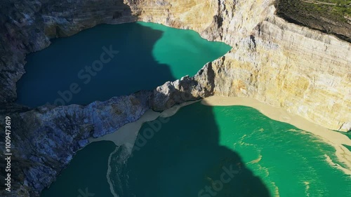 Aerial view of volcano Kelimutu with tricolored lakes in Flores
