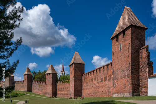 Gothic medieval fortification walls with towers in Nymburk, Czechia photo