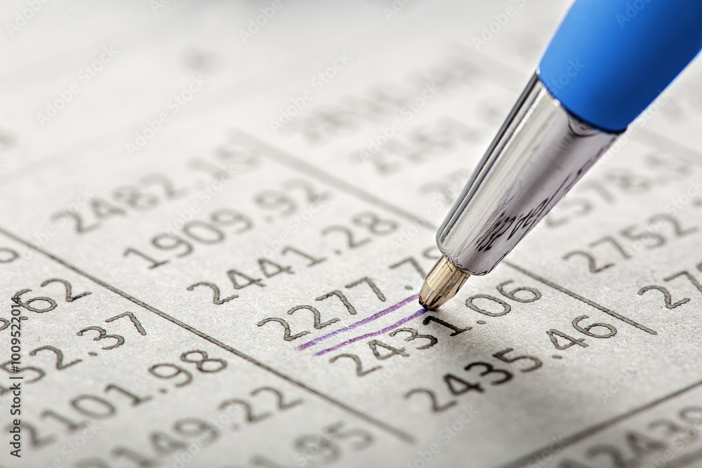 Accounting document with pen, money, coins and checking financial chart. Concept of banking, financial report and financial audit. Accounting document with pen, money, coins and checking financial chart. Concept of banking, financial report and financial audit.
