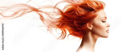  A woman with closed eyes and red hair billowing in the wind