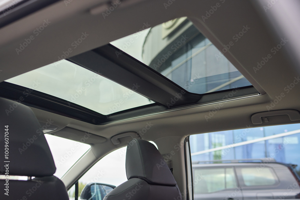 The interior design of a modern car sunroof incorporates sleek aesthetics and innovative features The interior design of a modern car sunroof incorporates sleek aesthetics and innovative features
