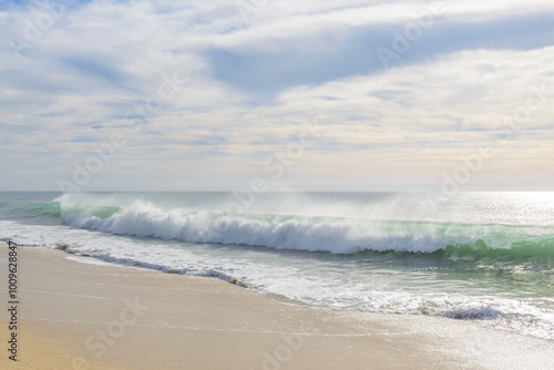 Different stages of the fantastic ocean waves. Rocky and sandy beach. Santa Maria Beach, Cabo San Lucas, Mexico.