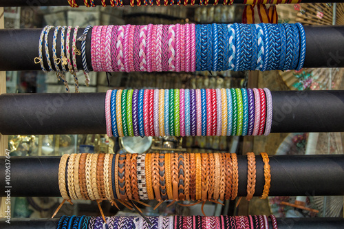 Coloured thread and leather bracelets at the entrance of a shop in Toledo, Spain photo