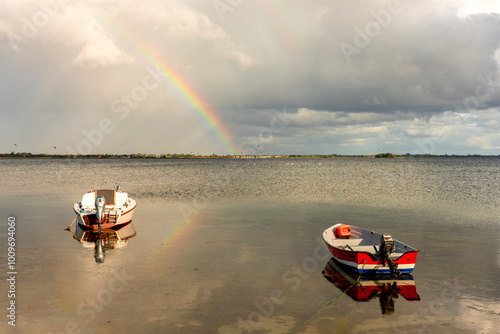 Idyllic Coastal Beauty on Rügen: Boats, Kitesurfers, and a Rainbow over the Großer Jasmunder Bodden