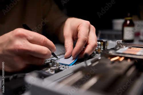 Hand Repairing a Graphics Card through the Application of Thermal Paste for Better Performance