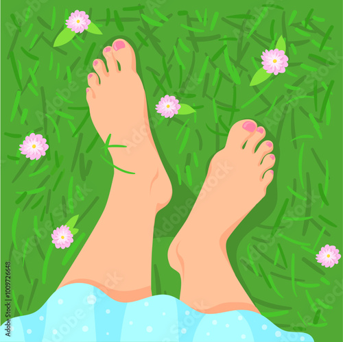 Bare feet on green grass top view. Nature selfie