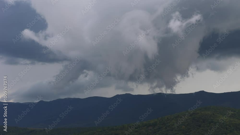 The Dramatic Storm Clouds Gathering Over Majestic Mountains Create a Powerful Atmosphere The Dramatic Storm Clouds Gathering Over Majestic Mountains Create a Powerful Atmosphere
