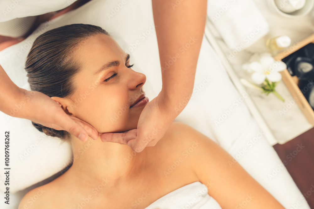 Obraz premium Panorama top view of woman enjoying relaxing anti-stress head massage and pampering facial beauty skin recreation leisure in dayspa modern light ambient at luxury resort or hotel spa salon. Quiescent