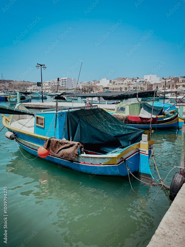 Traditional fisherman boats in a beautiful coastal town Marsaxlokk, Malta Island, Mediterranean Sea Traditional fisherman boats in a beautiful coastal town Marsaxlokk, Malta Island, Mediterranean Sea