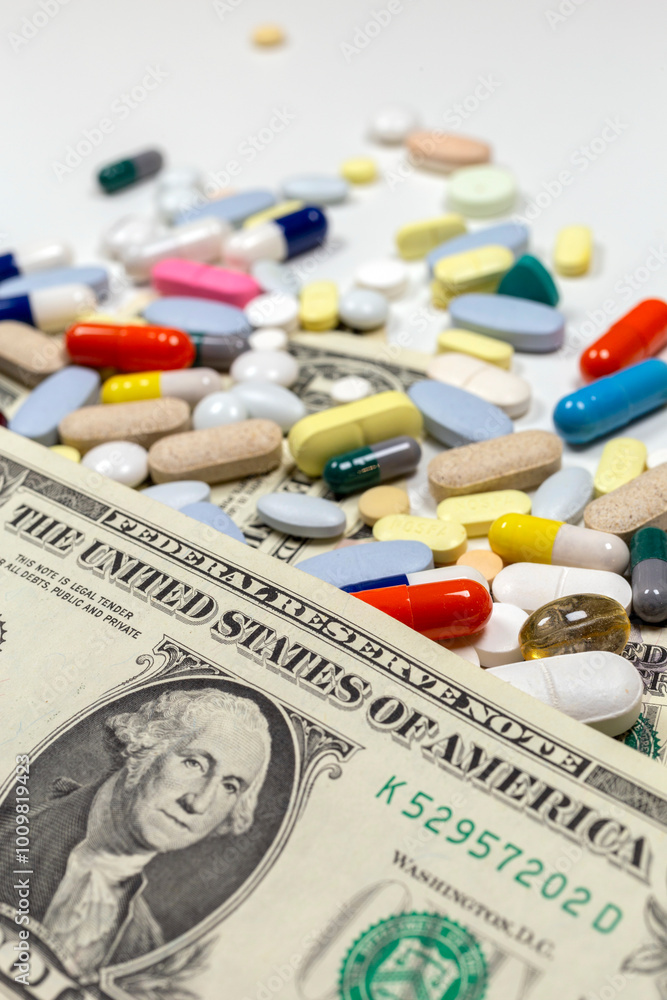 Colorful pills and tablets on US dollar bills Colorful pills and tablets on US dollar bills
