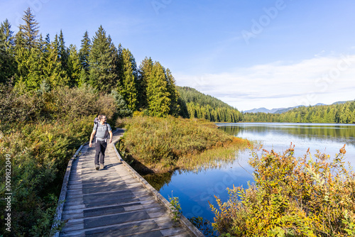 Scenic Walkway at Rolley Lake in Mission, BC, Canada with Lush Forest Views photo