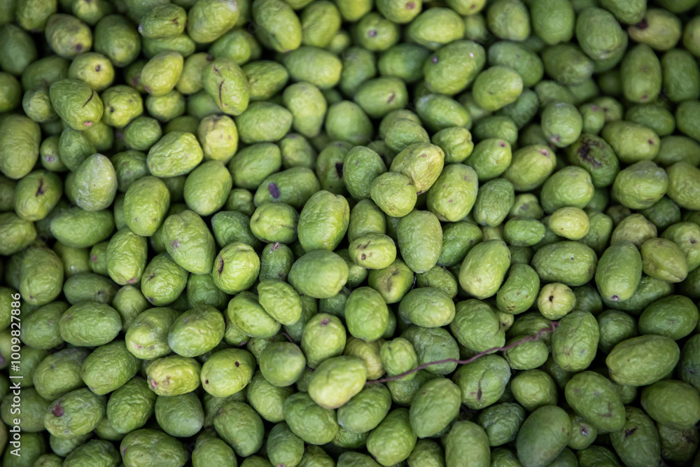 Green fresh olives on a stall for sale. Background. Green fresh olives on a stall for sale. Background.
