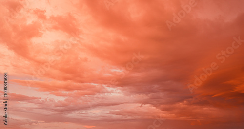 Beautiful colorful bright sunset sky with orange clouds. Nature sky background.