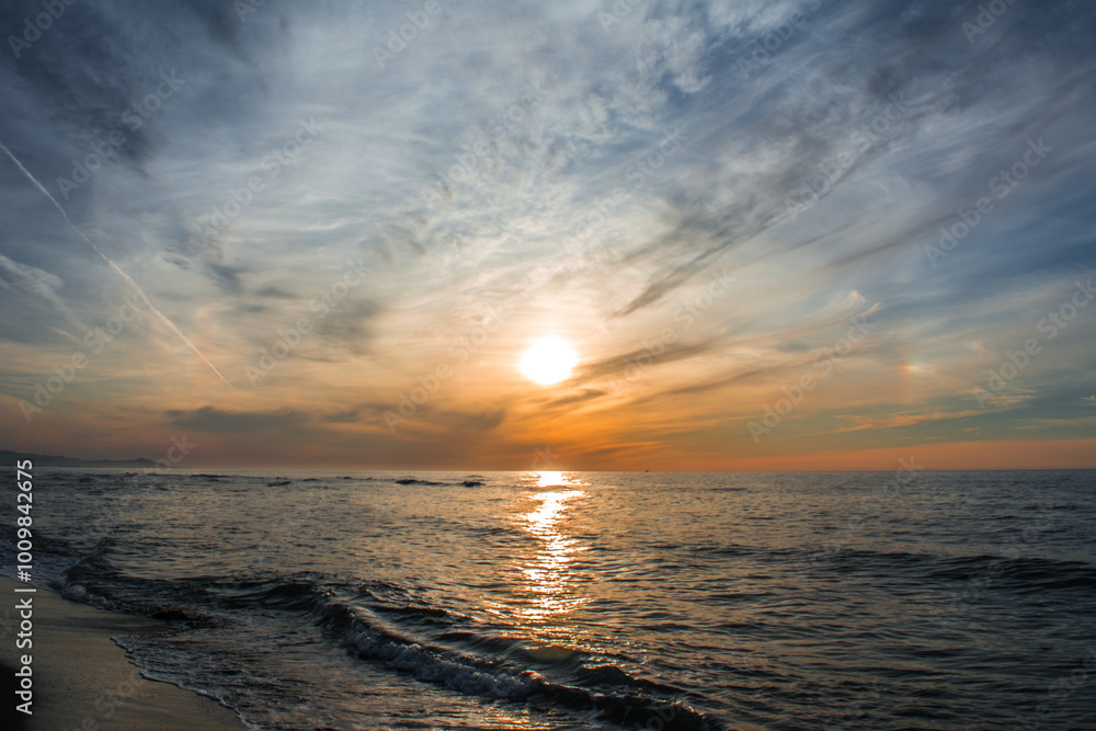 Obraz premium Dramatic sunset sea, clouds and beautiful orange sky, sandy beach and calm waves, Beauty landscape view of sea coast, Closeup sea beach,Calm tranquil relax summer tropical in mediterranean sea Algeria