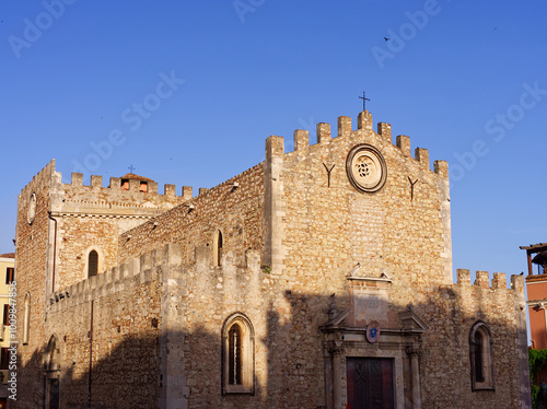 Taormina, Italy - May 24, 2024: Taormina Duomo San Nikolas church in summer sunset colors and shadows, Sicily 