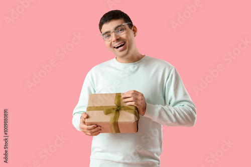 Happy young man with gift o...