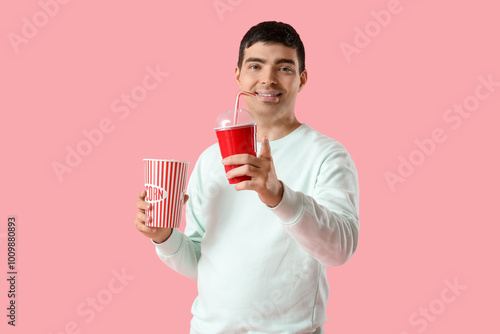 Happy young man with popcor...