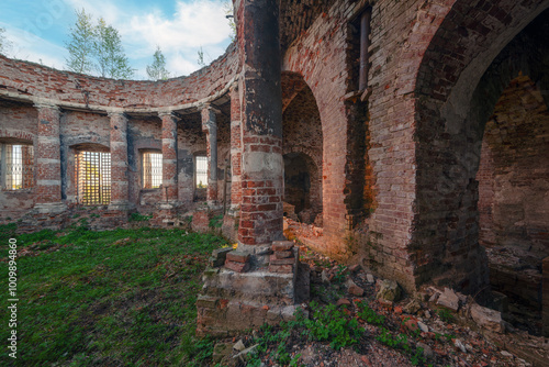 Old brick ruins of abandoned Church. Columned hall with collapsed roof