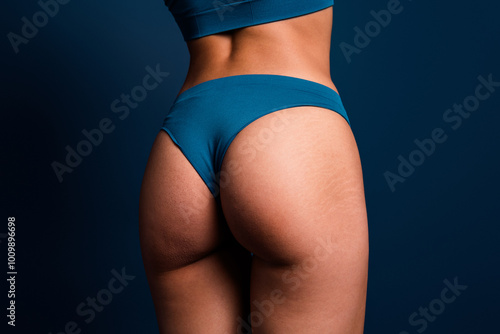 No retouch cropped photo of lady ass underwear lingerie enjoying self acceptance isolated blue color background