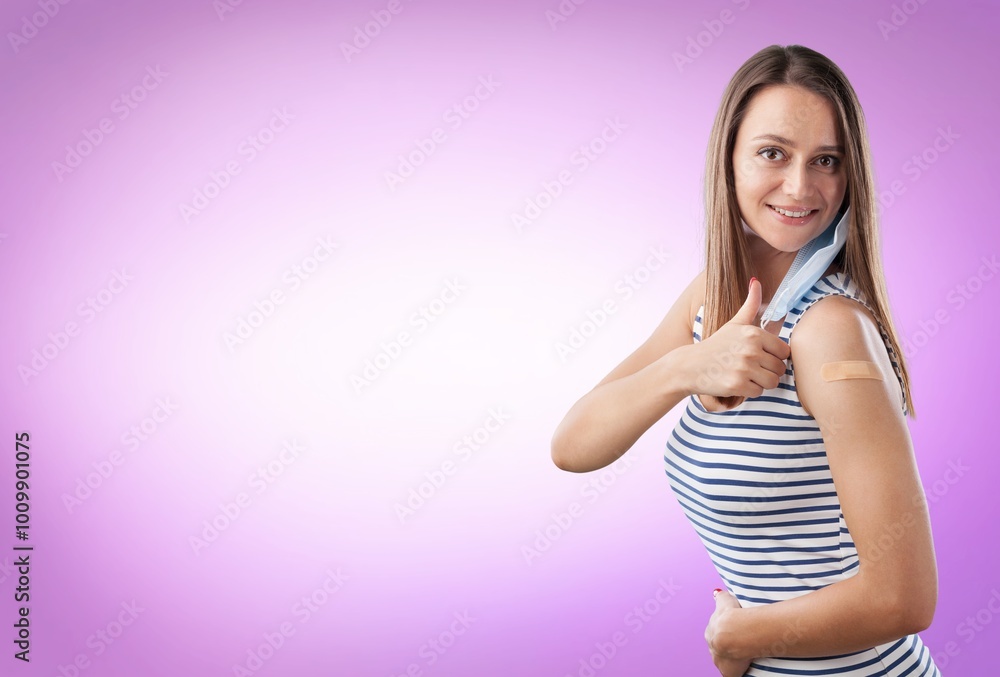 Φωτογραφία Teenager happy woman showing  bandage after vaccine