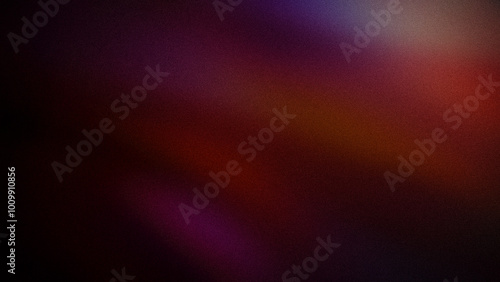 A dark grainy gradient blending deep reds, purples, and subtle oranges. This abstract backdrop creates a moody and rich atmosphere for digital design and backgrounds