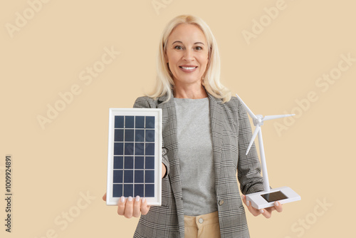 Mature woman with wind turb...