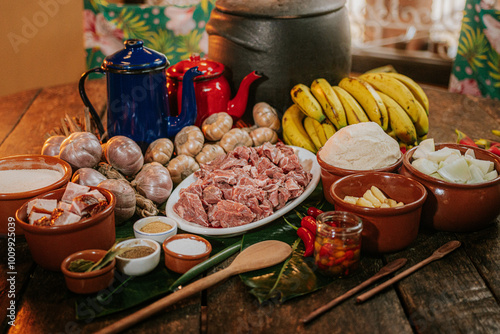 Barreado prato típico da região de Morretes e Antonina no Paraná, com mesa composta de ingredientes photo