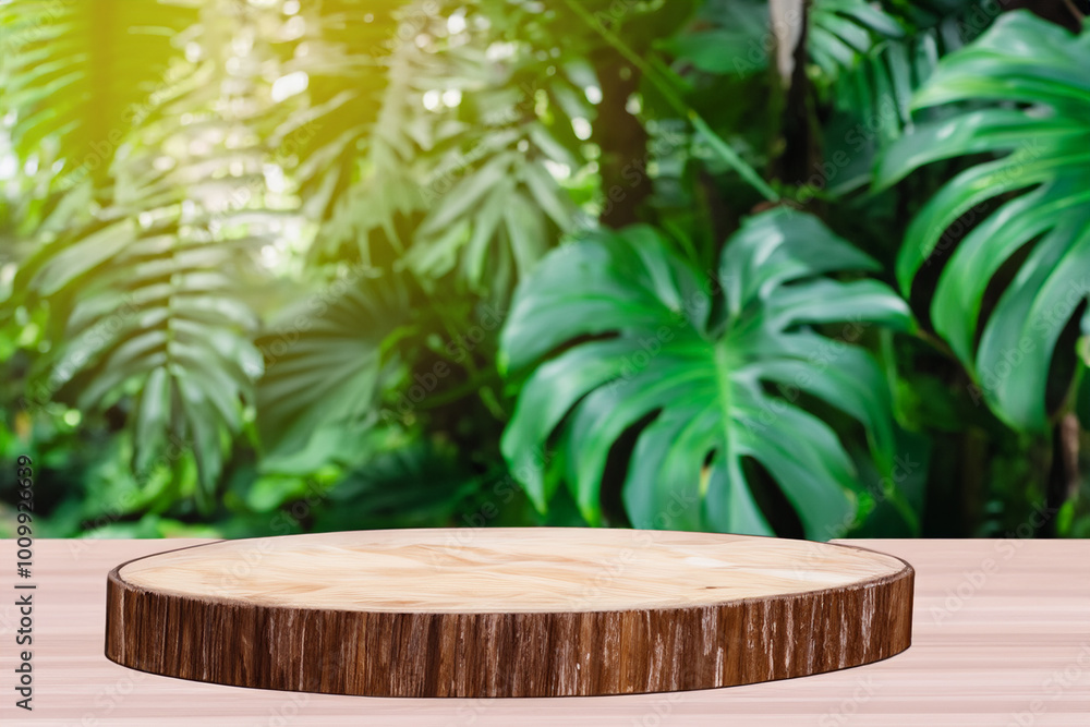 Wooden platform on a table with blurred green leaves in the background. Wooden platform on a table with blurred green leaves in the background.