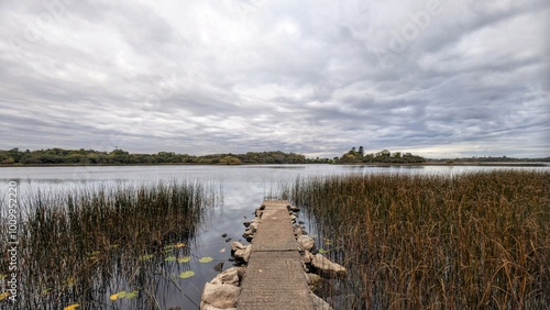 Obraz na płótnie Beautiful morning lakeside landscape scenery, mountains reflected in Ross lake, county Galway, Ireland, nature background w salonie