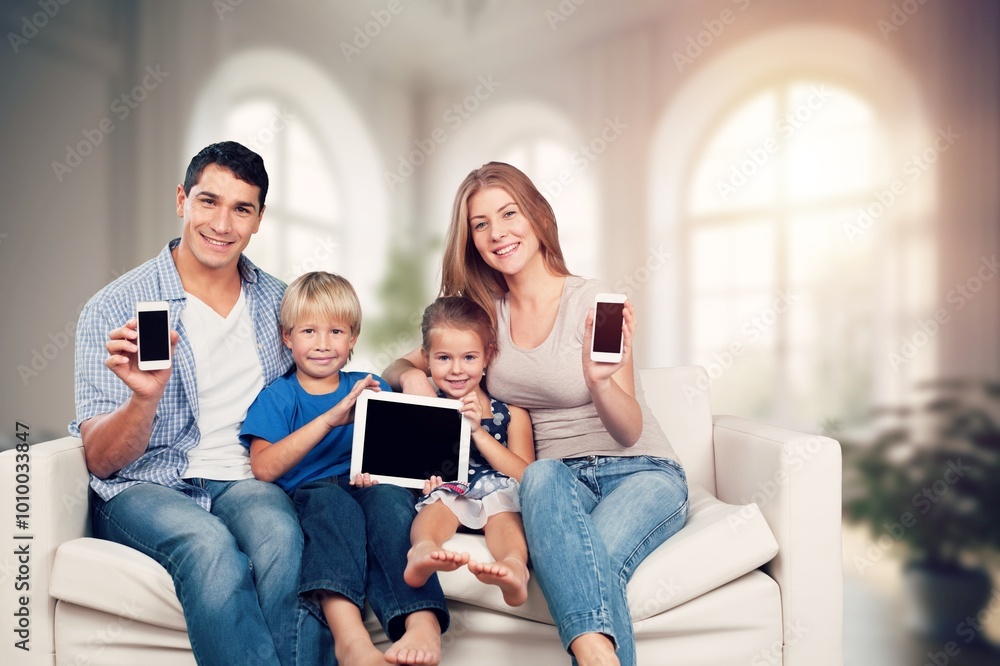Portrait of happy young family with children using gadgets Portrait of happy young family with children using gadgets