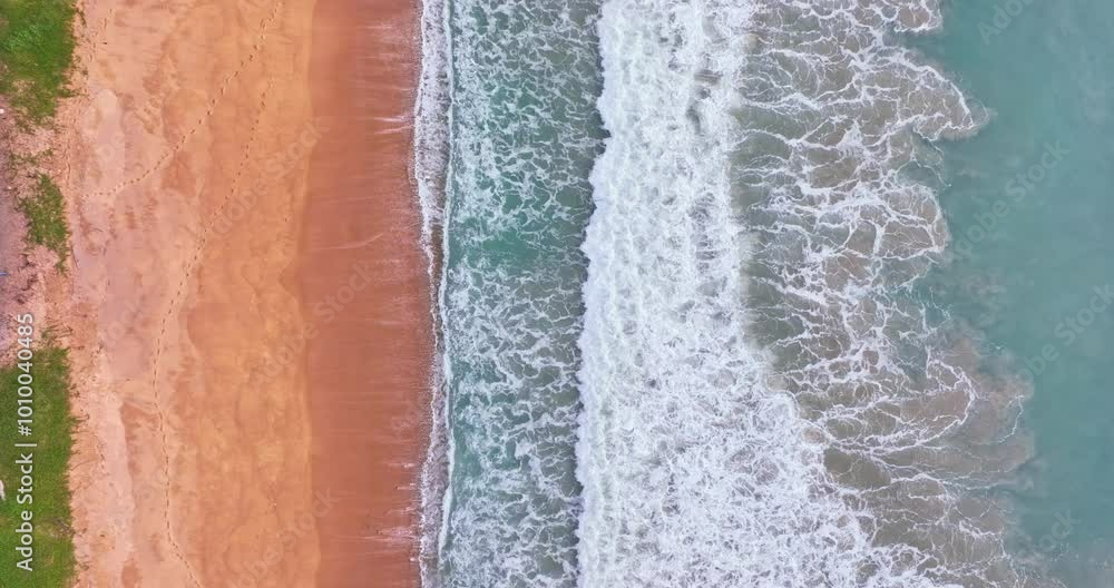 Beautiful sea summer landscape, Waves sea water surface High quality video Bird's eye view, Drone top view waves crashing on sand beach,Nature ocean sea beach background Beautiful sea summer landscape, Waves sea water surface High quality video Bird's eye view, Drone top view waves crashing on sand beach,Nature ocean sea beach background